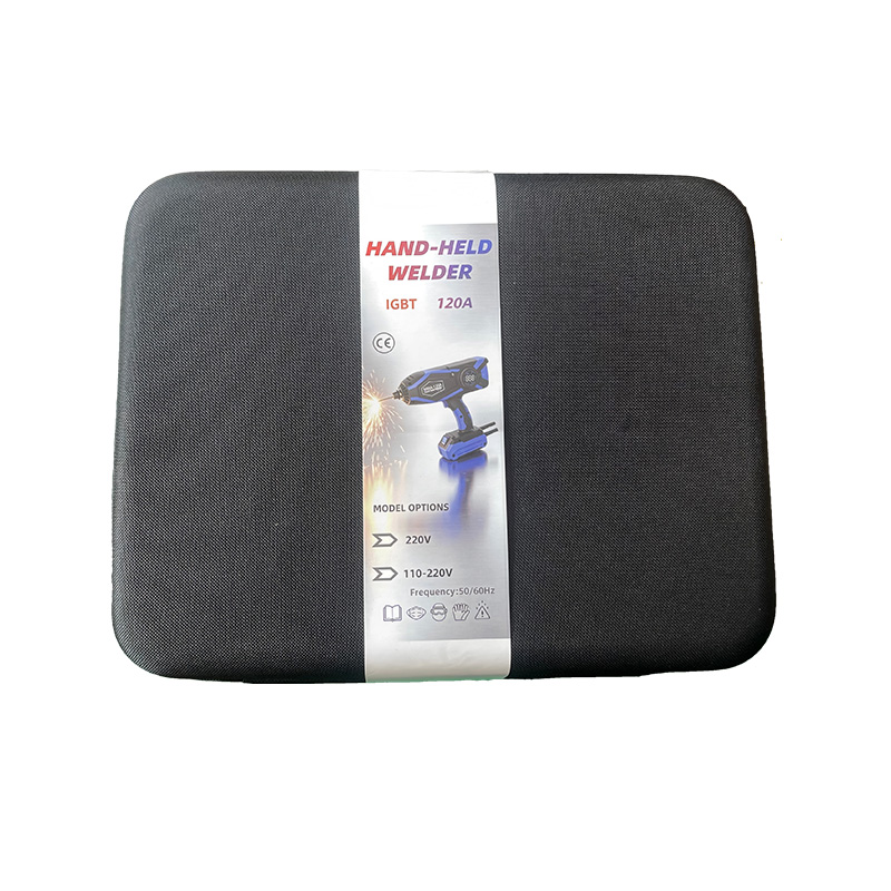 Black packing bag for handheld welder with a large product label showing "HAND-HELD WELDER IGBT 120A" and model specifications.